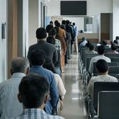 Example frame: a hospital waiting hall with a long queue